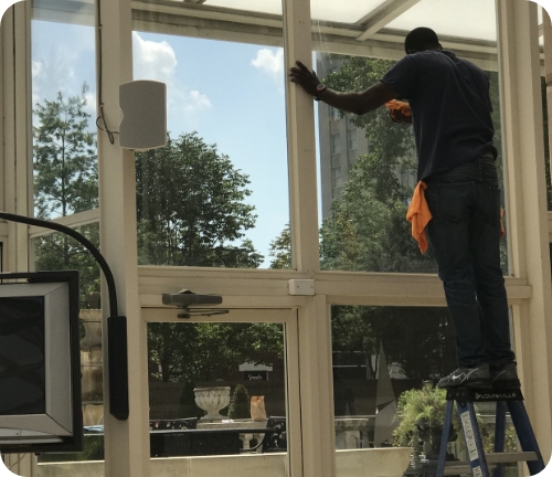 cleaning a building window